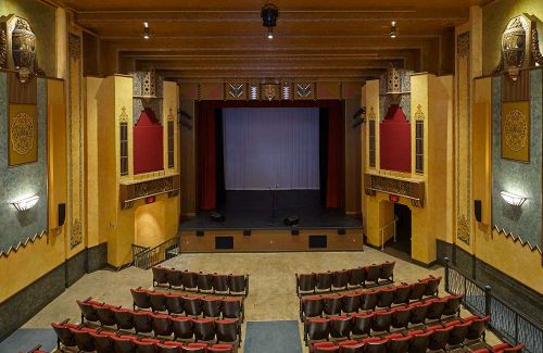 Historic West Bend Theatre features Period-Accurate Brass Light Gallery Fixtures