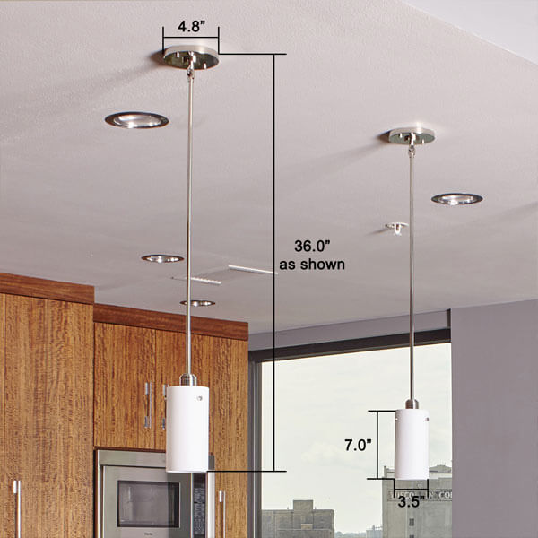 A trio of One Light Tribeca Pendants over top of an island in a modern condo kitchen.
