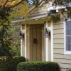 European Country™ Lantern 8 in. Wide Curved Arm Exterior Wall Light