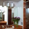 Three Light Tribeca Sconce lights a bathroom vanity